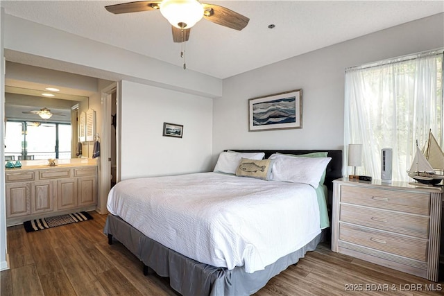 bedroom featuring dark wood-style floors and a ceiling fan