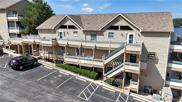 view of building exterior featuring uncovered parking