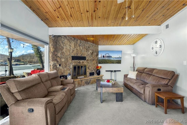 carpeted living room featuring lofted ceiling with beams, wood ceiling, a fireplace, and visible vents