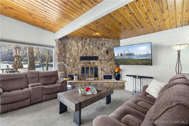 carpeted living room with beam ceiling, wooden ceiling, and a stone fireplace