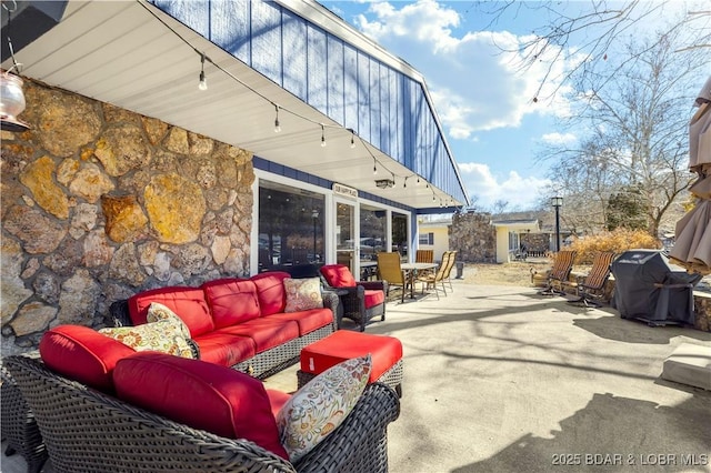 view of patio / terrace featuring an outdoor hangout area, outdoor dining area, and a grill