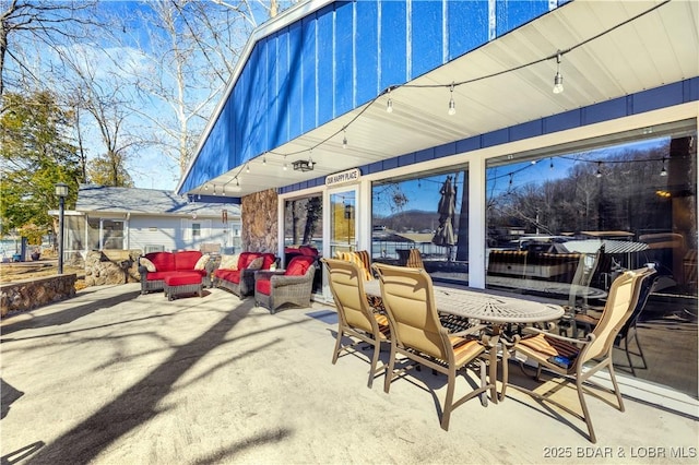 view of patio with outdoor lounge area and outdoor dining space