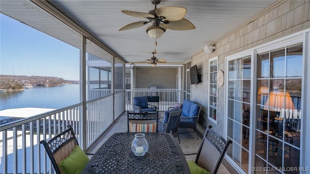68 Lighthouse Rd Unit 511, Lake Ozark, MO 65049 - sunroom with a water view, a ceiling fan, and healthy amount of natural light