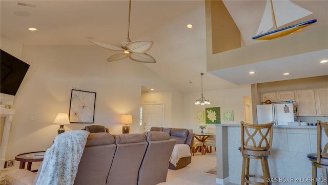 68 Lighthouse Rd Unit 511, Lake Ozark, MO 65049 - living area featuring lofted ceiling, ceiling fan, a chandelier, and recessed lighting
