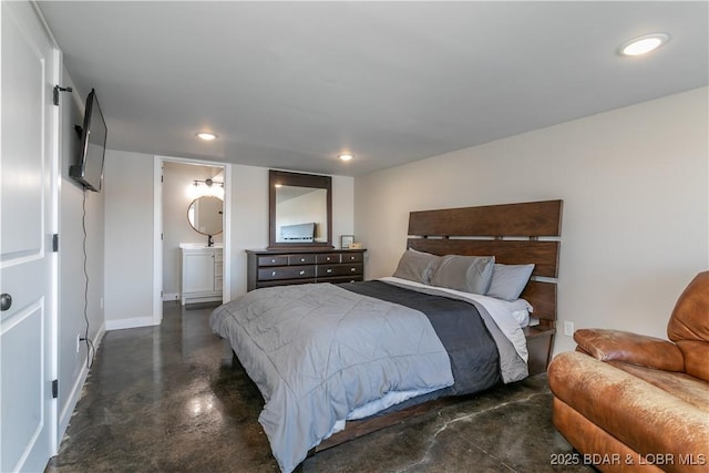 bedroom featuring baseboards, concrete floors, ensuite bathroom, and recessed lighting