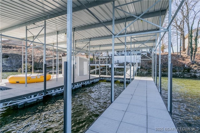 dock area featuring a water view and boat lift