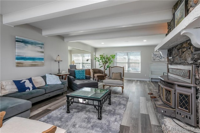 living area with recessed lighting, wood finished floors, beam ceiling, and baseboards