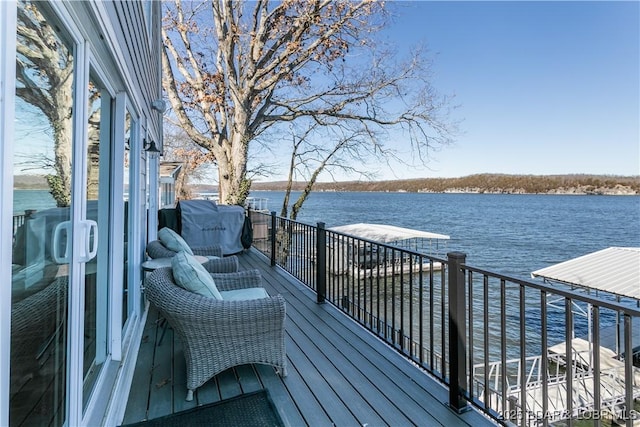 wooden deck featuring a water view