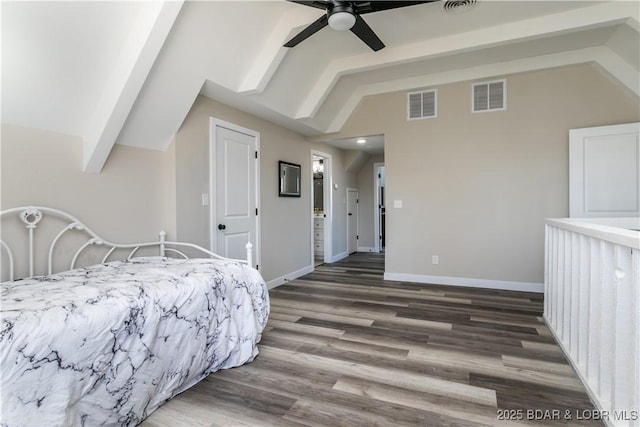 bedroom with lofted ceiling, visible vents, baseboards, and wood finished floors