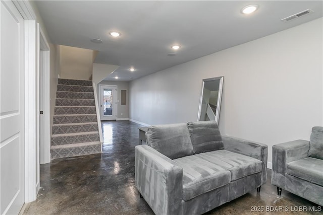 sitting room with recessed lighting, concrete floors, visible vents, baseboards, and stairway