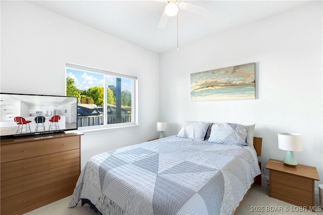 carpeted bedroom with a ceiling fan