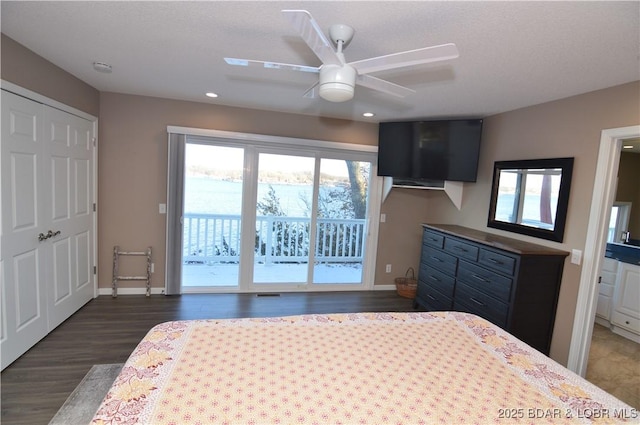 unfurnished bedroom featuring baseboards, dark wood finished floors, a ceiling fan, access to exterior, and recessed lighting