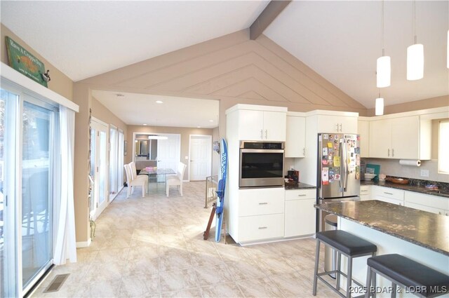 kitchen with lofted ceiling with beams, appliances with stainless steel finishes, visible vents, and white cabinetry