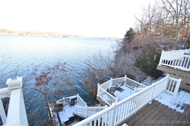 view of dock with a deck with water view