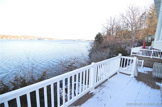 wooden terrace featuring a water view