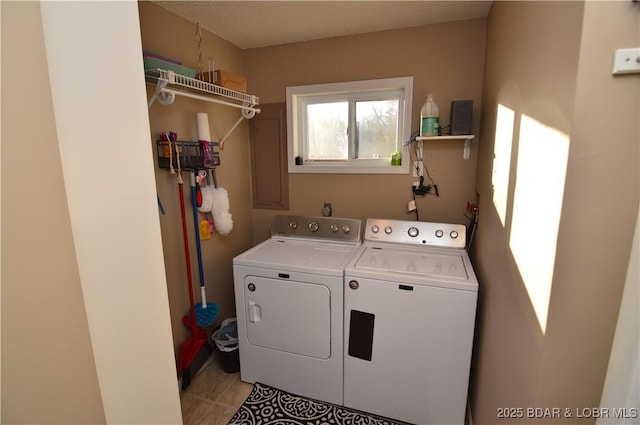 clothes washing area featuring laundry area and washing machine and dryer