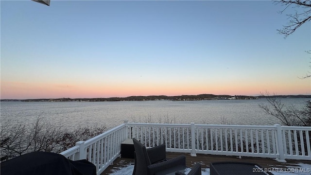 deck featuring a water view