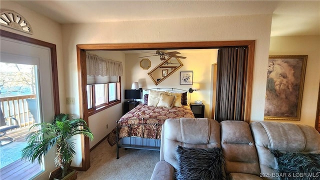 bedroom with carpet, multiple windows, and baseboards