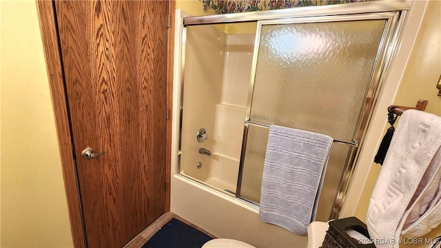 full bath with bath / shower combo with glass door