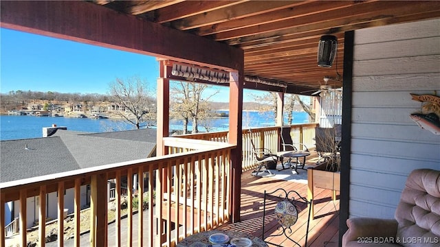 wooden deck with a water view