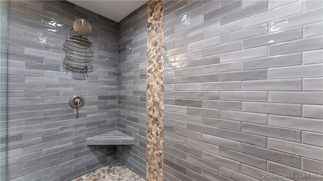 full bathroom with tiled shower