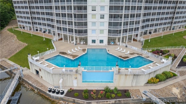 pool featuring a fenced backyard and a patio