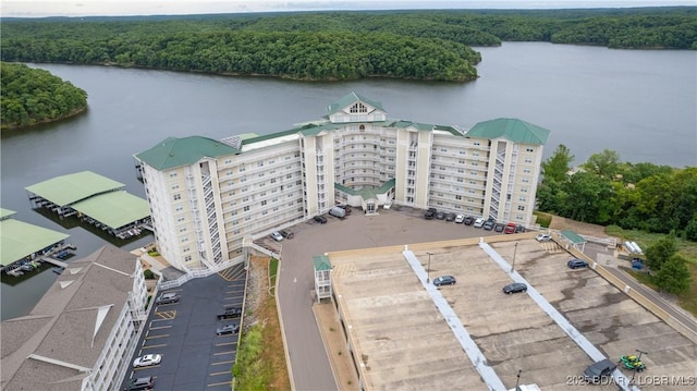 bird's eye view with a water view and a forest view