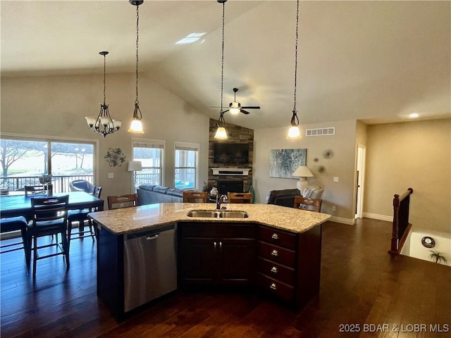 kitchen with dark wood-style flooring, visible vents, open floor plan, a sink, and dishwasher