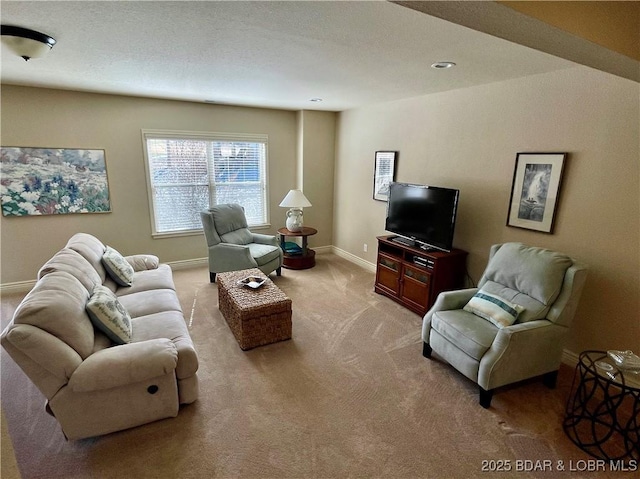 carpeted living room featuring baseboards