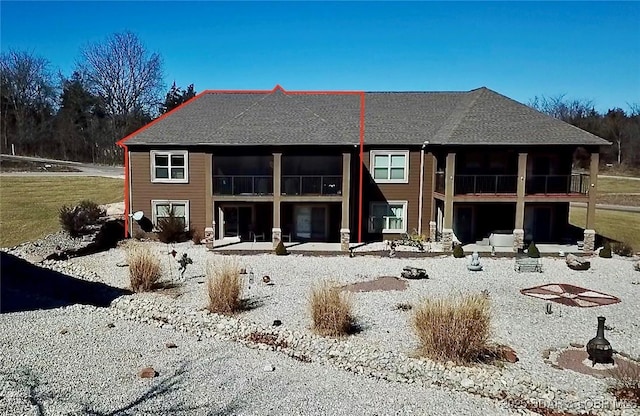 back of property with a patio and a balcony