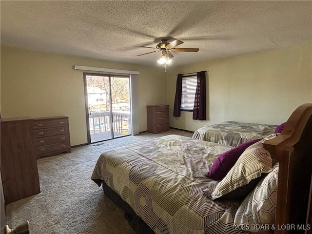 carpeted bedroom featuring access to exterior, multiple windows, a ceiling fan, and a textured ceiling