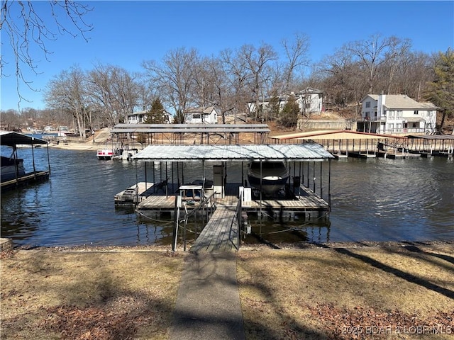 dock area featuring a water view and boat lift