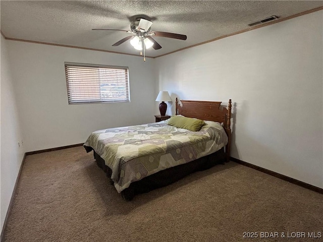 carpeted bedroom featuring a textured ceiling, ornamental molding, visible vents, and baseboards