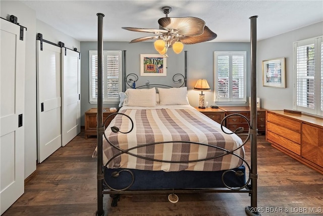 136 Rambling Acres Dr, Gravois Mills, MO 65037 - bedroom featuring ceiling fan, a barn door, and dark wood finished floors