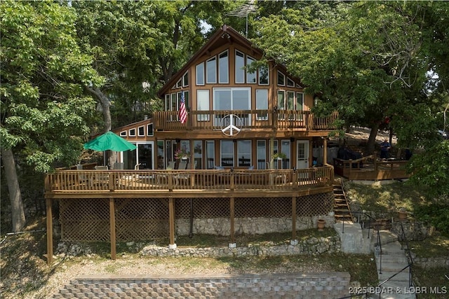 back of house with a deck and stairway