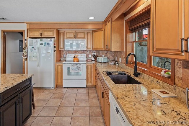 136 Rambling Acres Dr, Gravois Mills, MO 65037 - kitchen with light tile patterned flooring, light stone countertops, white appliances, a sink, and decorative backsplash