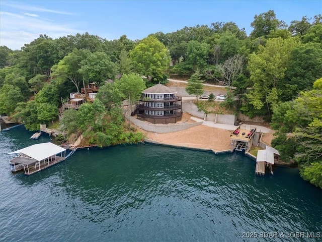 birds eye view of property with a water view