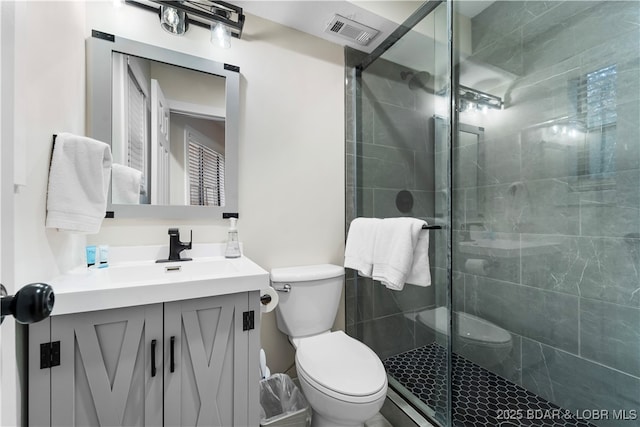 full bathroom with toilet, a shower stall, visible vents, and vanity