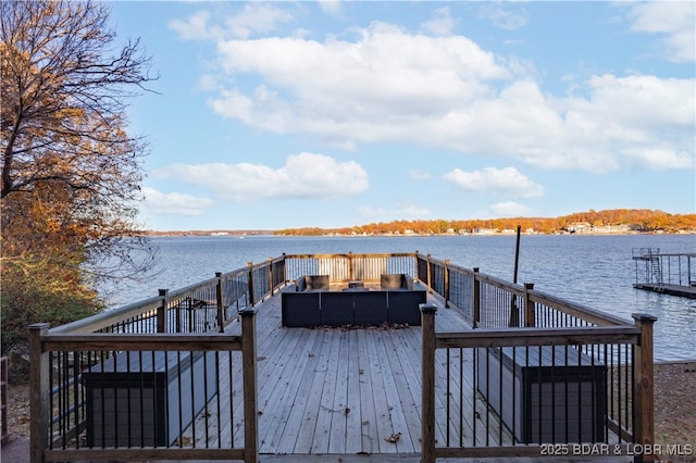 dock area with a deck with water view