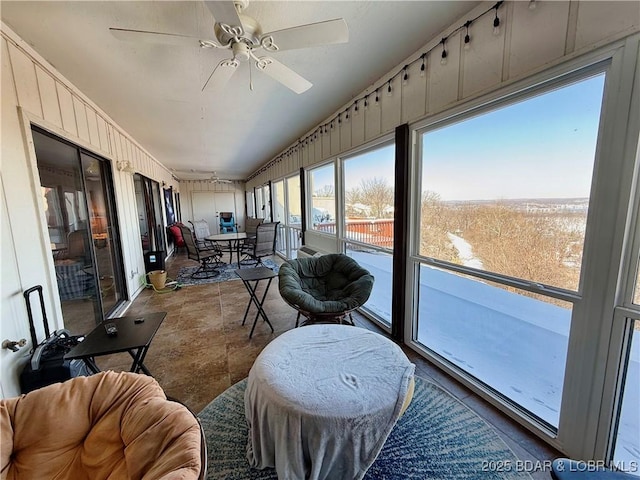 sunroom / solarium with ceiling fan