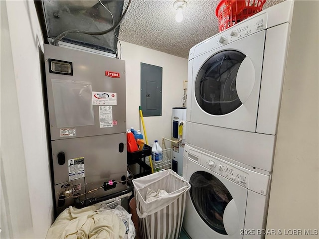 laundry room with laundry area, electric panel, a textured ceiling, stacked washing maching and dryer, and water heater