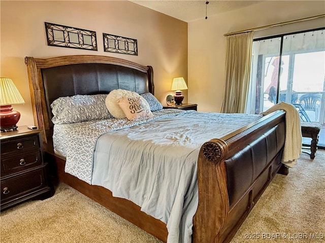 bedroom featuring access to outside and light colored carpet