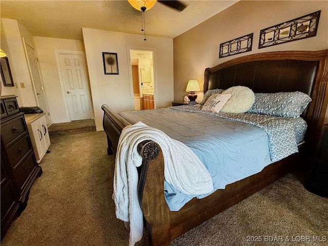 carpeted bedroom with baseboards and connected bathroom