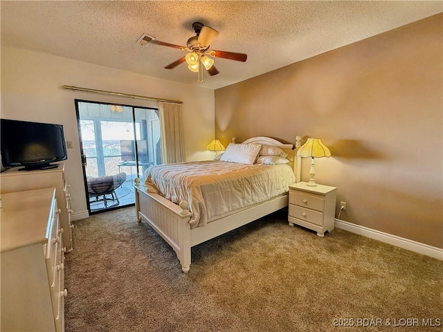 carpeted bedroom featuring baseboards, a textured ceiling, and access to exterior