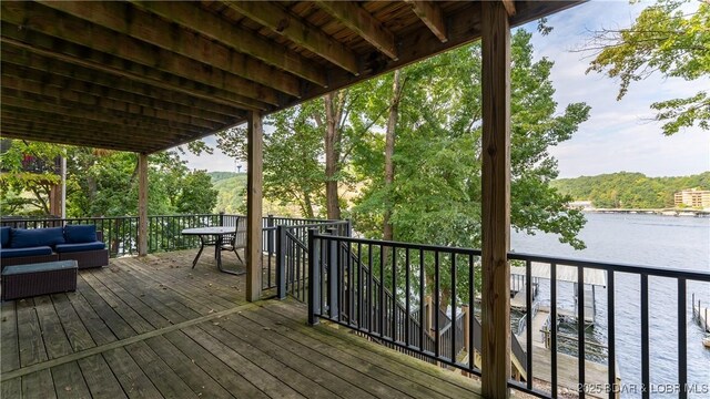 wooden terrace with a water view