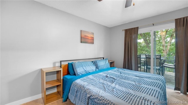 carpeted bedroom with access to outside, baseboards, and a ceiling fan