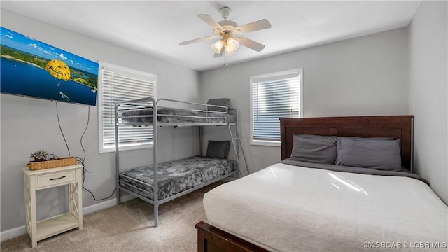 bedroom featuring baseboards, carpet floors, and ceiling fan