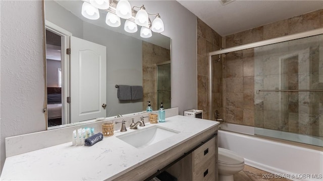 full bath with vanity, an inviting chandelier, toilet, and enclosed tub / shower combo