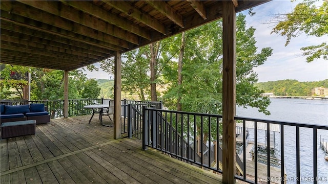 wooden deck with a water view