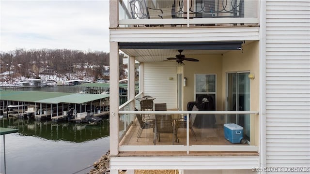 view of dock with a water view and a balcony